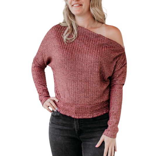 woman wearing mauve shimmer off-the-shoulder top with long sleeves
